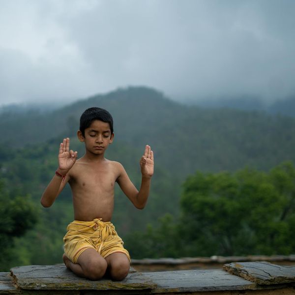 A serene person meditating in a calm and peaceful environment.